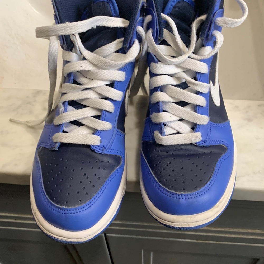 Blue and white kid nikes